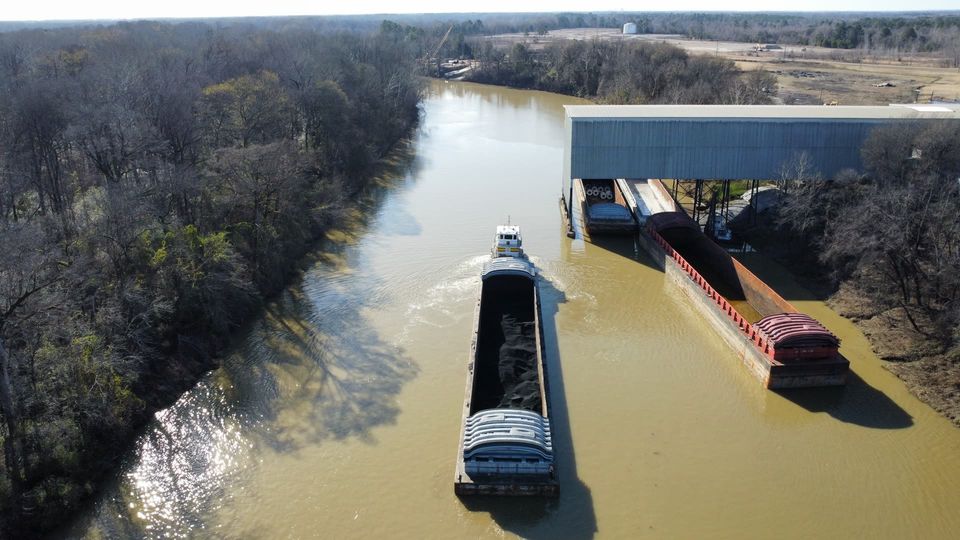 Aerial view of two tows passing on the canal section of the Tenn-Tom.