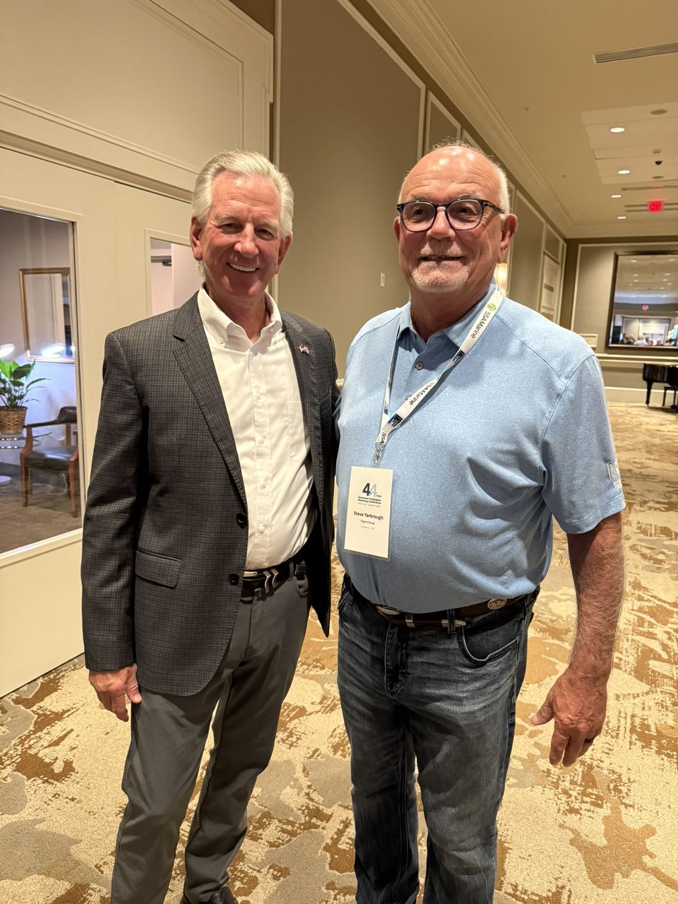 Two attendees pose together.