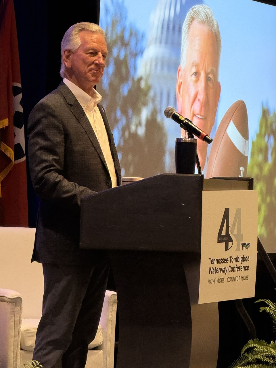 A speaker at the Tennessee-Tombigbee Waterway Conference podium.