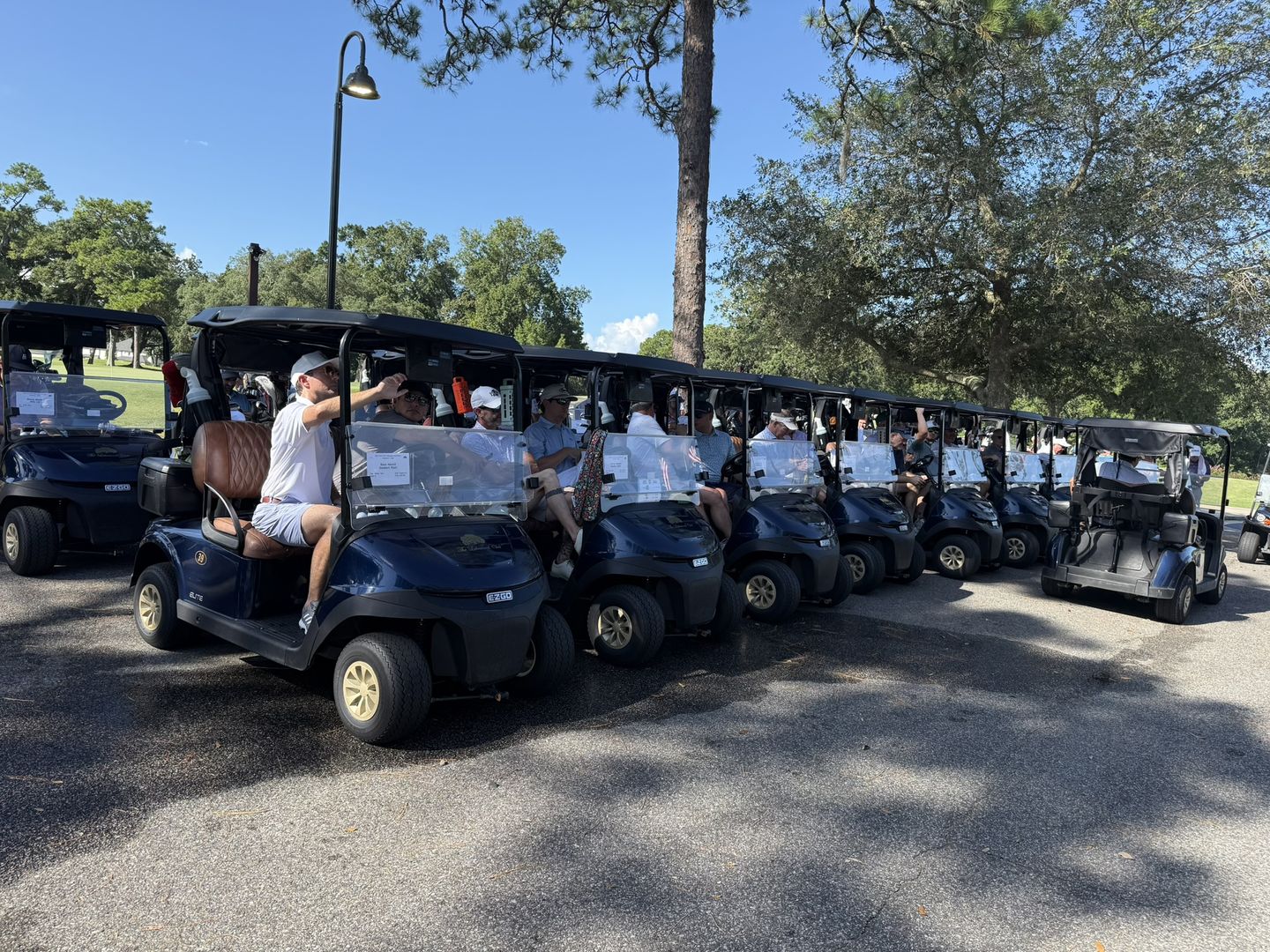 A line of golf carts ready at the start of the conference golf tournament.