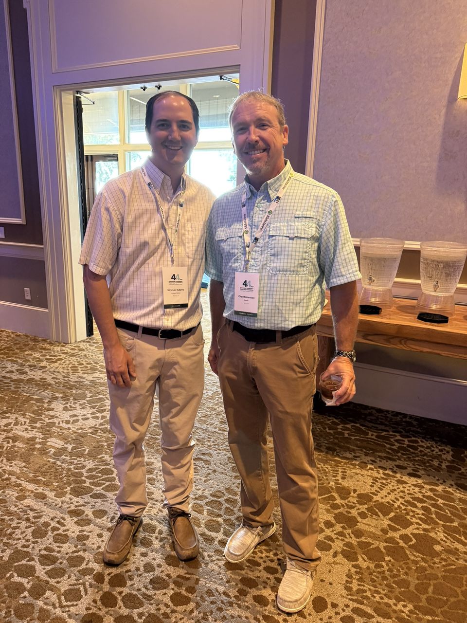 Two attendees pose together.