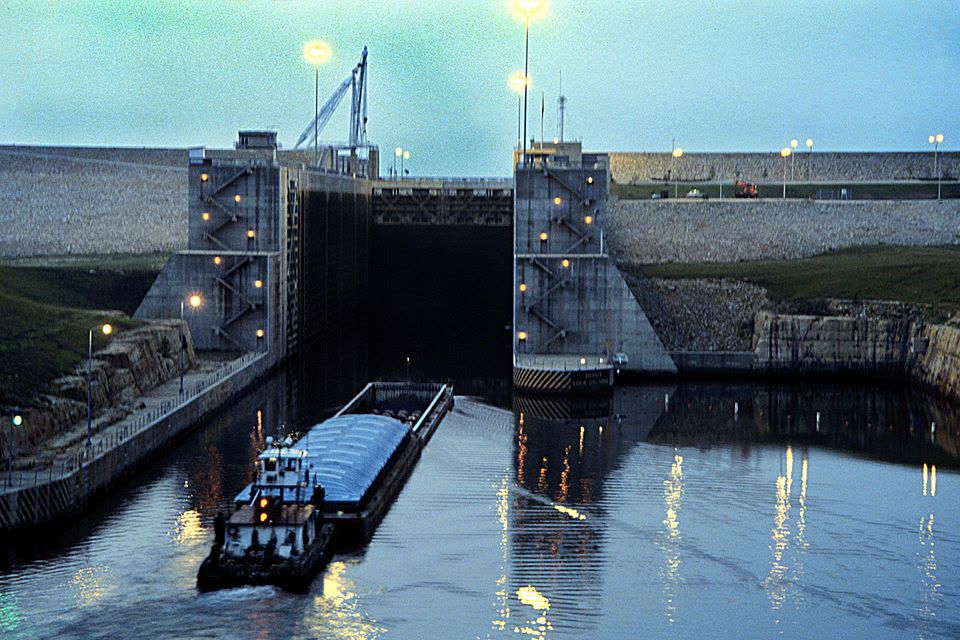 A tow enters Jamie Whitten Lock at dusk.